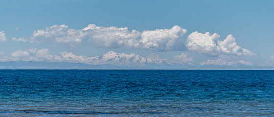 Obraz premium View Across Lake Titicaca into the Bolivian Andes Mountain Range
