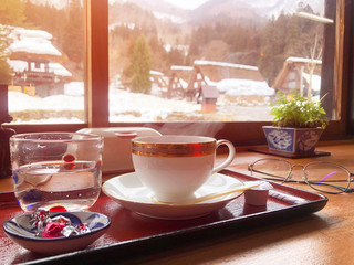 Coffee in the morning  and enjoying the winter snow view at Shirakawago village, Gifu, Japan.