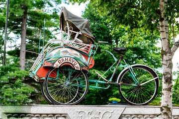 Fototapeta na wymiar Tricycle rickshaw with sidecar front