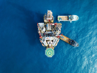 Aerial view offshore jack up rig at the offshore location during sunset
