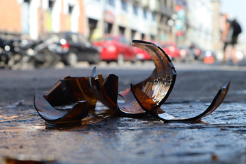 Smashed glass beer bottle in the floor in Mexican City