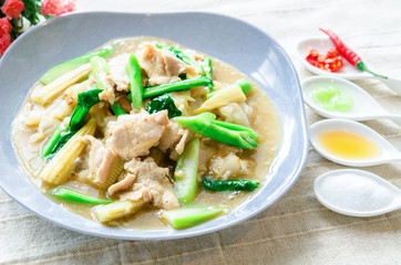 Homemade Stir-Fried Noodles with Gravy Sauce on table.