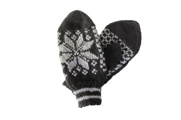 Woolen mittens with winter ornaments, isolated on a white background