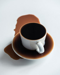 cup of coffee poured over