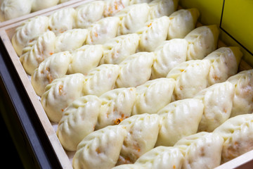 South Korean style streamed dumpling in wood container prepared for sell