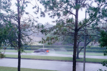 fast moving car in the rain 