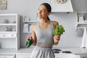 Healthy eating. Dieting and people concept. Brunette with a vegetable.