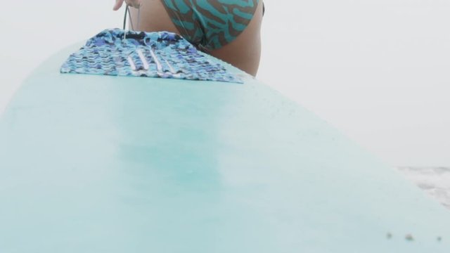 Beautiful young asian woman in bikini sexy pulling and walking windsurf for relax at beach in summer, girl slim to travel for leisure in season tropical holiday, water sea and ocean, nature seascape.