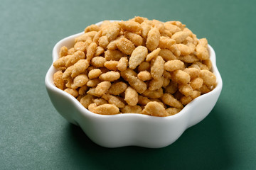 side view salty sunflower seeds snack on a dish