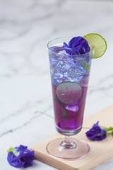 Healthy drink, organic blue pea flower tea with lemon and lime.