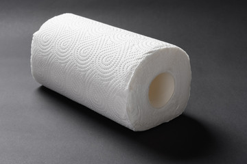 brand new paper roll for kitchen on black background