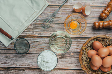 Baking Ingredient- flour, egg, milk, rolling pin, background. Top view, flat lay, copy space