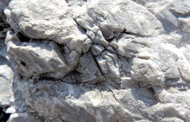 embossed stone marble surface with cracks and breaks  , selective focus