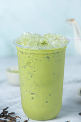 Matcha ice green tea on marble floor It is a delicious and nutritious relaxation drink.