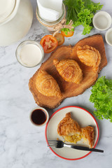 Stuffed chicken curry puffs on the table fall beautifully.