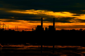 power plant at sunset