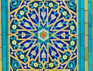Tiles with colored patterns on the wall of the old mosque.