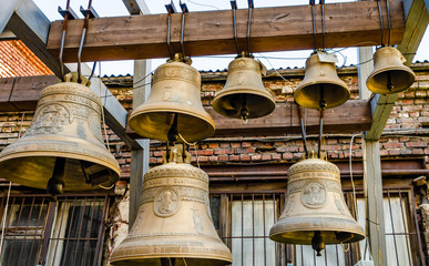 There are many old copper bells near the Church.