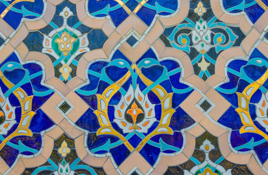 Tiles with colored patterns on the wall of the old mosque.