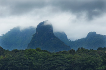 Raining cloud over the mountain and forest near border Thailand and Laos