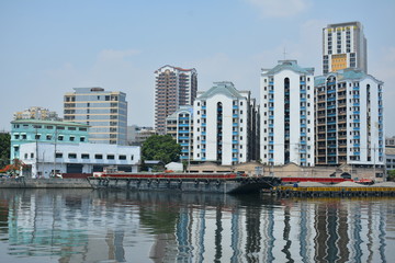 Fototapeta premium Neighboring buildings cityscape at Pasig river in Manila, Philippines