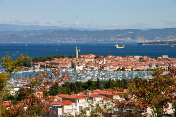 Slovenian beautiful old town and a marina of Izola can be seen in the foreground. Trieste in Italy can be seen in the back ground.
