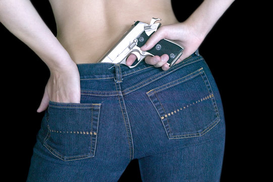 Closeup Shot Of Female Holding A Gun