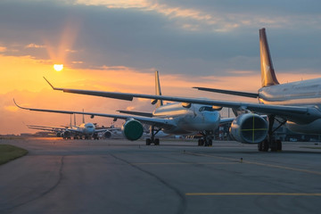 Aircraft are closely line up for long term parking at taxiway of airport due to COVID-19  © heychli