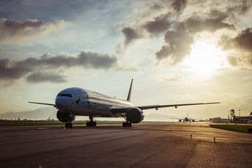 Fototapeta na wymiar Aircraft taxiing to airport runway