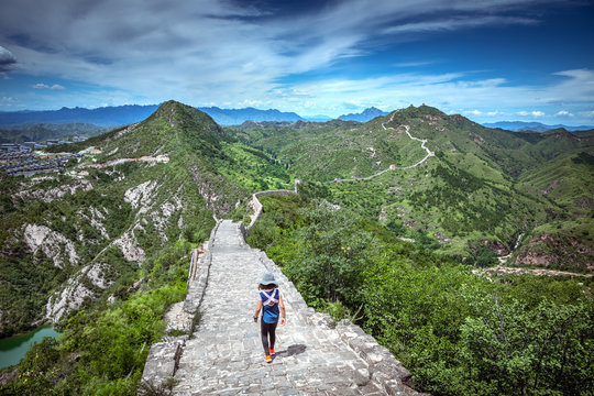 A little girl walking along the Great Wall of China