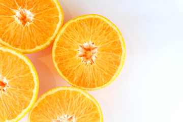 slices of orange on white