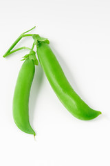 Two pea pods isolated on a white background.