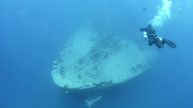 Technical diver diving a underwater ship wreck