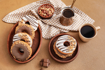 Composition with tasty donuts and coffee on table