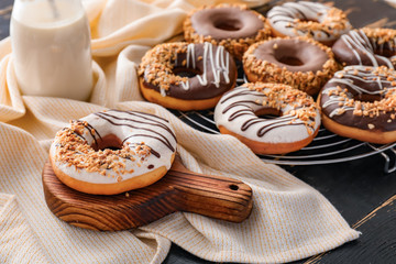 Sweet tasty donuts on table