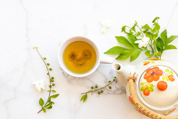 herbal healthy drinks hot chrysanthemum tea local flora of asia with teapot, flower jasmine ,purple in summer season arrangement flat lay style on background white 