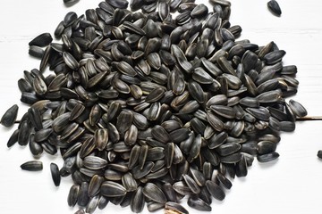Sunflower seeds on a wooden background.Organic and eco food concept. Healthy food and fats.