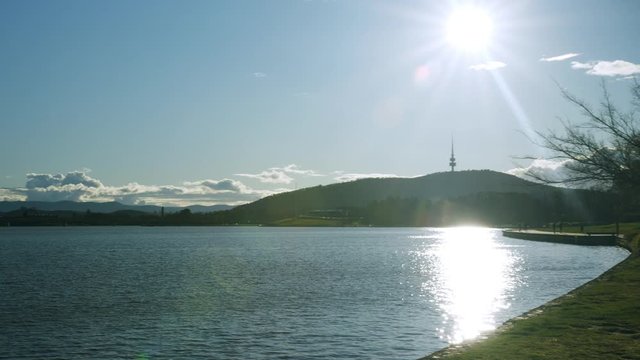 Wide angle panning shot of Lake Burley Griffin and Telstra Tower, Canberra
