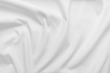 Abstract white fabric texture background. Cloth soft wave. Creases of satin, silk, and cotton.