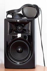 Headphones and professional sound monitor while paused.