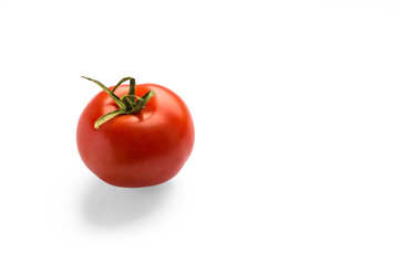 Red tomato on a white background. One tomato. tomato with drops