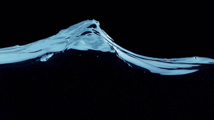 Closeup of water waves isolated on black