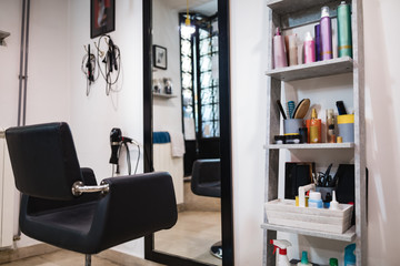 Empty hair salon interior with chairs and mirrors.