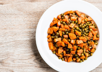 Fried  carrots  with green peas in plate , in door  Chiangmai  Thailand