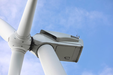 Wind turbine against beautiful sky, closeup. Alternative energy source