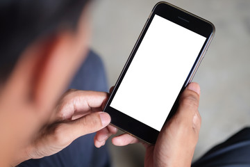 Cropped shot view of man hands holding smart phone with blank copy space screen for your text message or information content, female reading text message on cell telephone during in urban setting. 