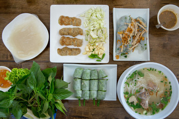 Flat lay photography of the Vietnamese food set on the wood table