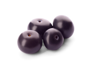 Fresh ripe acai berries isolated on white