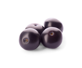 Fresh ripe acai berries isolated on white