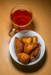 black tea with snacks on a table in a beautiful lighting